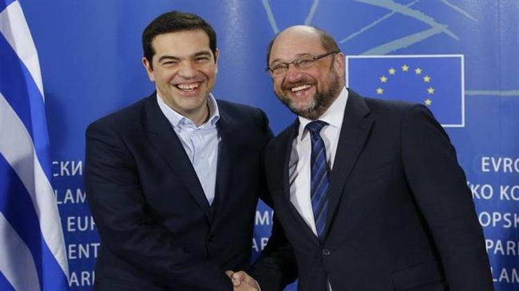 Flying Colours - Debt - Carrying Tsipras Breezes Through Brussels